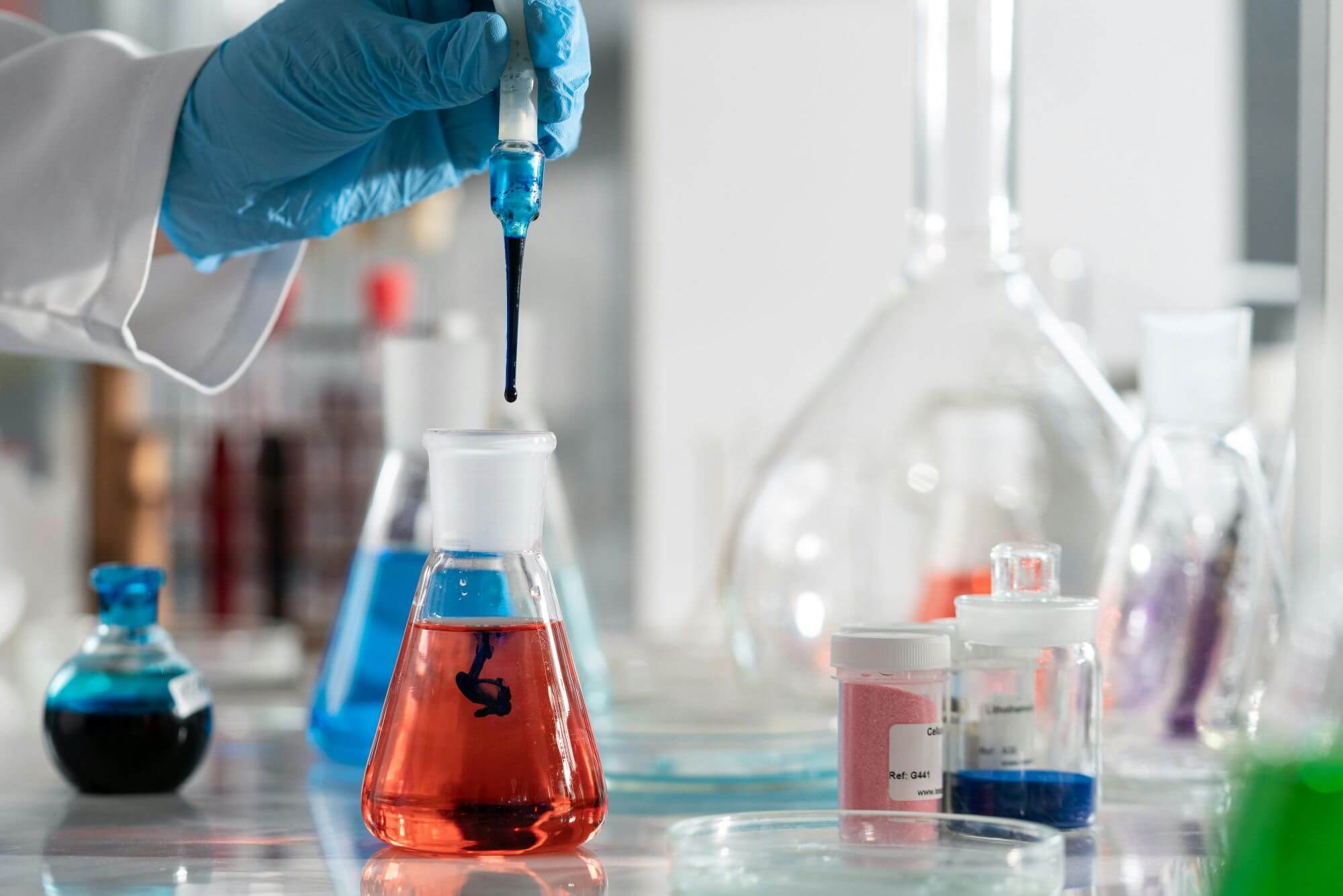 Science student carrying out an experiment in a lab